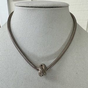 Older knot necklace on serpentine chain